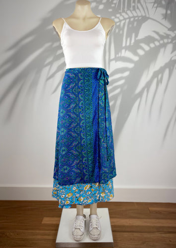 The gorgeous Goddess silk blend wrap skirts by Cienna designs, in a stunning sapphire blue and emerald pattern, with a turquoise and yellow patterned second layer.  These skirts are reversible so choose the pattern that suits your mood!   Can also be worn as a dress 